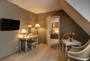 Telewizja i/lub zestaw kina domowego w obiekcie Hotel Wawel