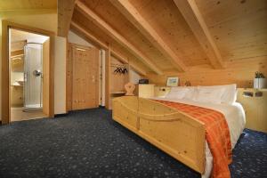Postel nebo postele na pokoji v ubytování Hotel Cristallo