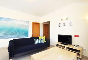 TV a/nebo společenská místnost v ubytování Casa Baleia - Praia e Piscina - 10 pessoas