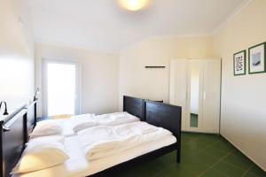 Postel nebo postele na pokoji v ubytování Casa Baleia - Praia e Piscina - 10 pessoas