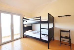 Postel nebo postele na pokoji v ubytování Casa Baleia - Praia e Piscina - 10 pessoas + 15 fotografií