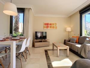 a living room with a couch and a table at Roda Golf Resort 4109 - Nicky in San Javier