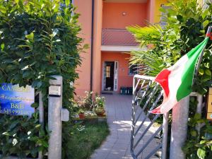 a flag of nigeria in front of a building at A Due Passi Dal Mare B&B in Numana