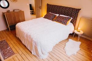 Ένα ή περισσότερα κρεβάτια σε δωμάτιο στο Les Apparts d 'Agnès - Carmen +4 φωτογραφίες