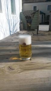 a glass of beer sitting on a table at Landgasthof Fischer Veri in Mitterfels