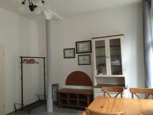 a dining room with a table and a fireplace at Ferienwohnung Mittendrin -Balkon- in Meißen +10 photos