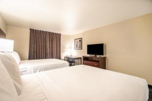 Voodi või voodid majutusasutuse Cobblestone Hotel & Suites - Andrews toas