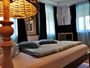 Łóżko lub łóżka w pokoju w obiekcie Villa Komposch - adults only