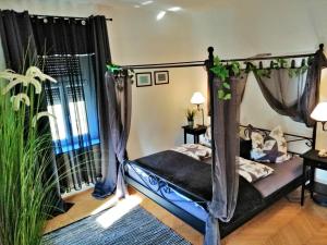 Voodi või voodid majutusasutuse Villa Komposch - adults only toas