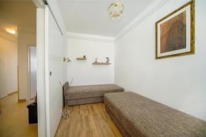 a bedroom with two beds in a room at Illy Apartman in Eger