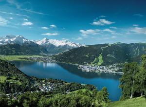 a view of a lake with mountains in the background at DD Apartments Zell am See in Zell am See