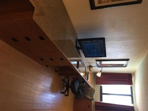 a room with a staircase with a tv on the ceiling at Wyndham Garden Hotel Austin in Austin