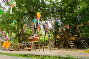 a playground in a park with a play equipment at Hosteria Tonusco Campestre in Santa Fe de Antioquia