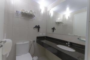 Koupelna v ubytování Hotel Confiance Barigui