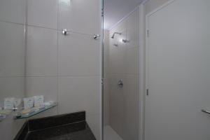 Koupelna v ubytování Hotel Confiance Barigui