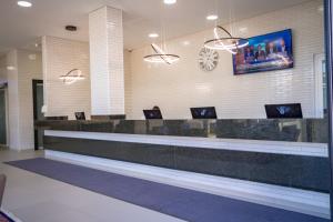 TV a/nebo společenská místnost v ubytování Hotel Confiance Barigui