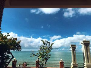 a view of the ocean from a building at Hon Rom Central Beach Resort in Mui Ne