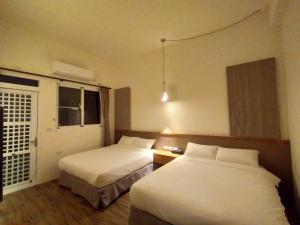 Кровать или кровати в номере Wang yuan B&B