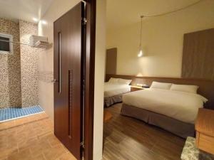 Кровать или кровати в номере Wang yuan B&B