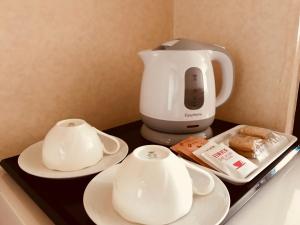 Příslušenství pro přípravu čaje a kávy v ubytování Shakespeare Hotel