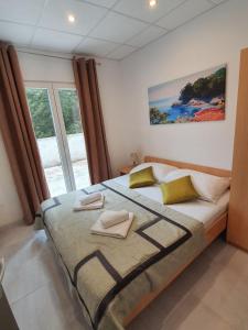 Postel nebo postele na pokoji v ubytování Villa Brasina