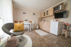 Kuchyň nebo kuchyňský kout v ubytování Apartmány U Sjezdovky