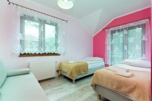 Кровать или кровати в номере Apartamenty Krakowska