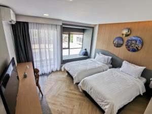Cama o camas de una habitación en RICO Hotel Ratchadapisek 32
