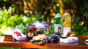 a table with a bottle of wine and food on it at Beijing Kuntai Royal Hotel in Beijing