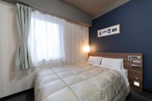 Letto o letti in una camera di Hotel Econo Tsu Station