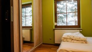 Posteľ alebo postele v izbe v ubytovaní MSC Apartments Zaciszny Kącik