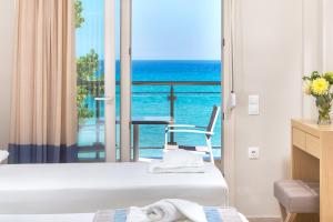 a hotel room with a view of the ocean at Iliorama Luxury Apartments in Skala Potamias