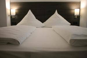 Postel nebo postele na pokoji v ubytování ILL Hotel by WMM Hotels