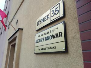 Certyfikat, podpis lub inny dokument wystawiony w obiekcie Apartamenty Stary Browar Oleśnica