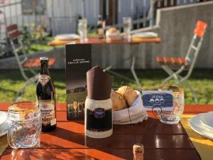 a table with two bottles of wine and a box at Le Castagne Matte in Stenico