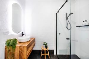 a bathroom with a sink and a shower at Peppertree Terraces in Mudgee