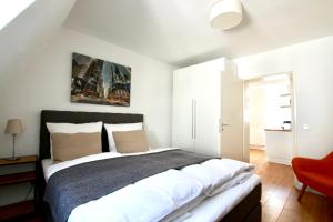 Katil atau katil-katil dalam bilik di Arthouse Apartments am Eigelstein