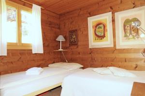 Ένα ή περισσότερα κρεβάτια σε δωμάτιο στο Chalet Trollius +27 φωτογραφίες