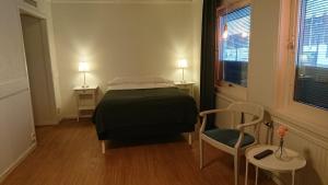 Ένα ή περισσότερα κρεβάτια σε δωμάτιο στο Övik Eventhotell