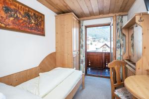 Postel nebo postele na pokoji v ubytování Heart Hotel Talhof Nigg