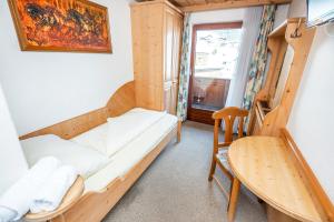 Postel nebo postele na pokoji v ubytování Heart Hotel Talhof Nigg