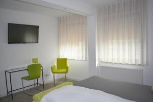 TV a/nebo společenská místnost v ubytování Hotel Hegemann garni