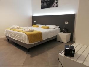 a bedroom with a large bed and a tv at Suite Dreams in Verona in Verona