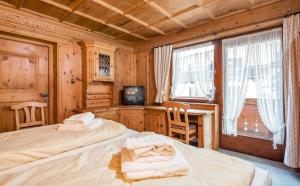 Postel nebo postele na pokoji v ubytování Heart Hotel Talhof Nigg