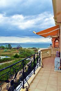 a balcony with a view of the ocean at Anvers Apartments in Sozopol
