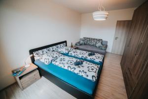 מיטה או מיטות בחדר ב-Apartmán Tatranská Lomnica