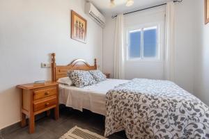 Postel nebo postele na pokoji v ubytování APARTAMENTO LUZ A