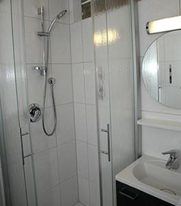 a bathroom with a shower and a sink at Landgasthaus Zum Mönchshof in Wolframs-Eschenbach