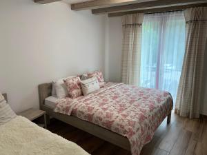 Postel nebo postele na pokoji v ubytování Apartmány POCO LOCO