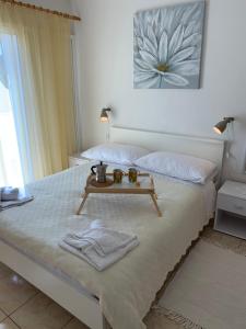 Postel nebo postele na pokoji v ubytování Apartments Ema
